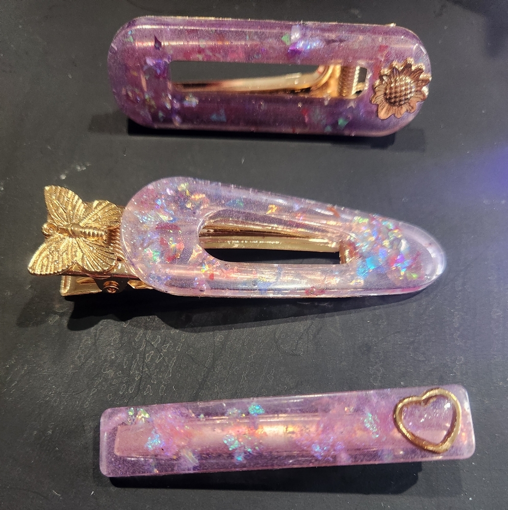 Set of 3 resin barrettes with charms.